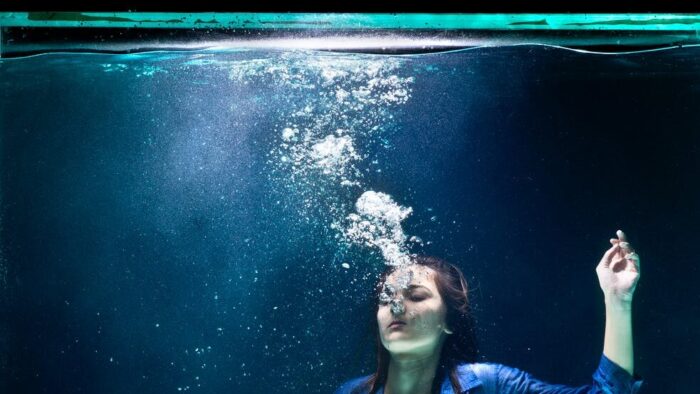 underwater photography of woman